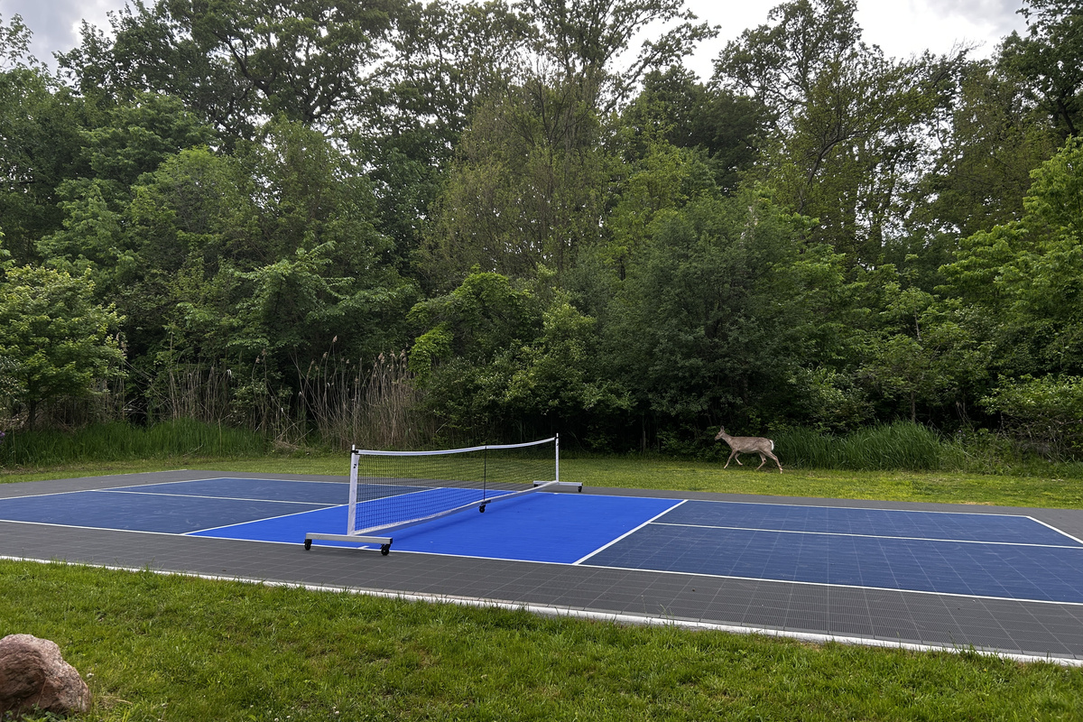 The onsite pickleball court has a Sport Court surface and is shared with the guests in the Cabin. Deer frequently pass by the court.