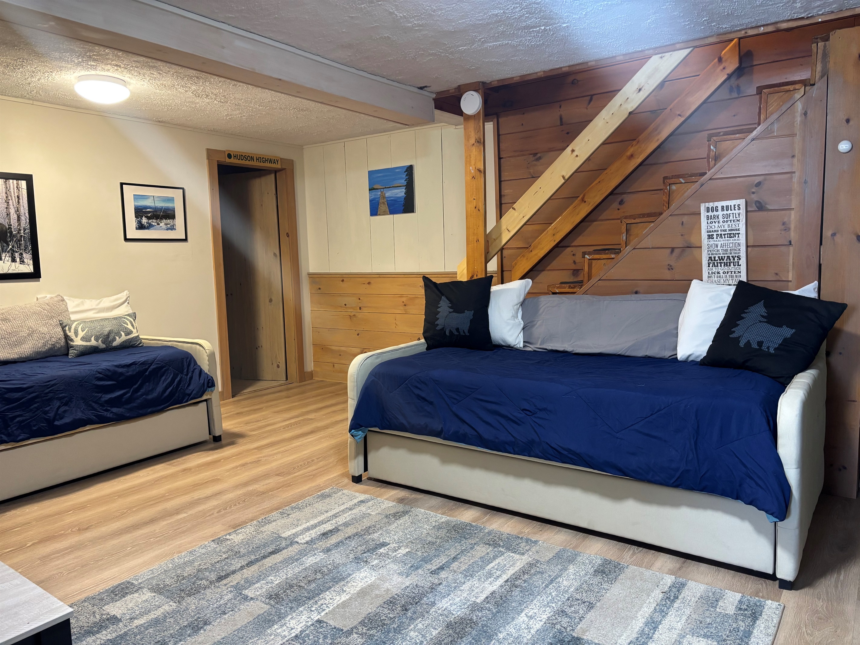 Lower level sitting area with day beds and trundles