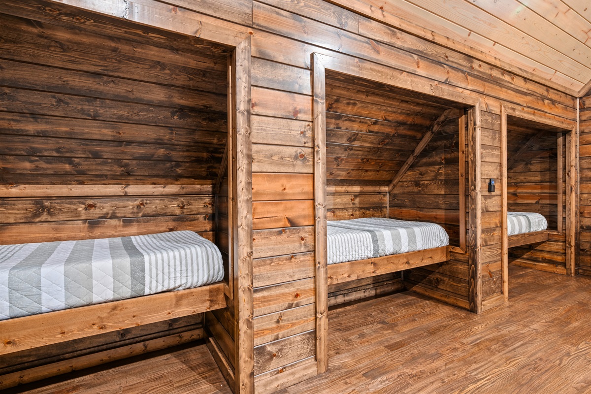 These built-in twin bunks are such a fun touch, creating a sleep space that feels playful and perfect for a group getaway.