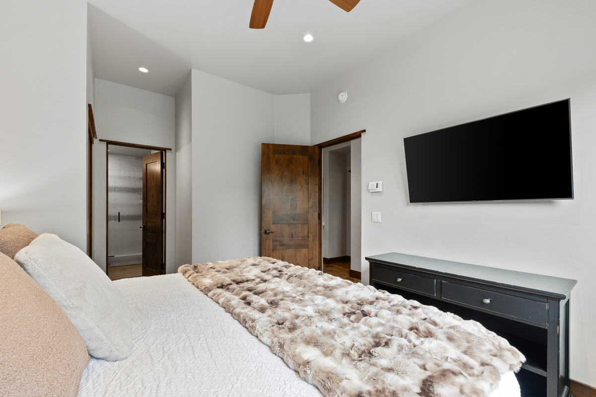 Guest bedroom #2 is a mini suite with King bed, tv and attached full bathroom