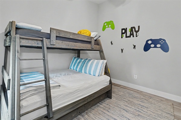 Kid-approved bunk room with a twin-over-full bunk + trundle for extra guests and extra fun!