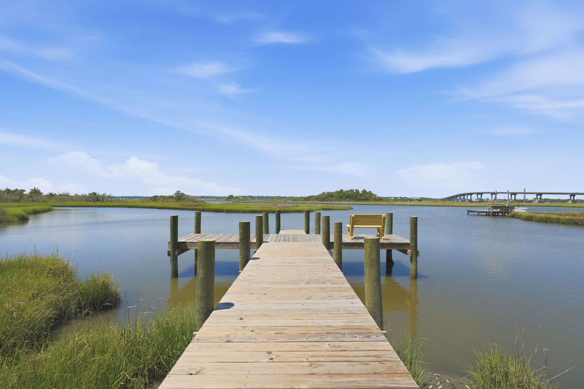 The private dock is the perfect place to enjoy morning coffee, sunset views, fishing, or simply unwind by the water