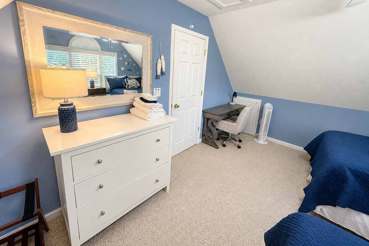 Cozy upstairs retreat with mirror and vanity