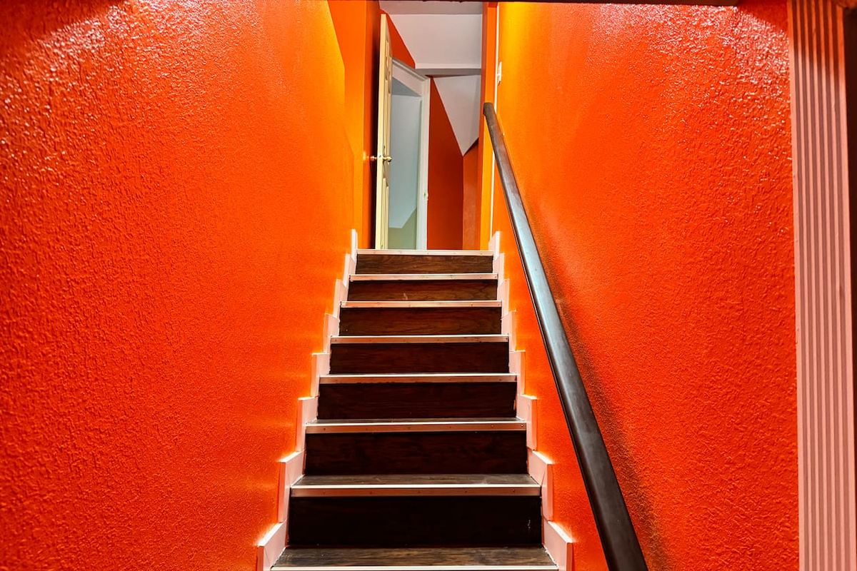 Stairs leading up to 3 extra bedrooms