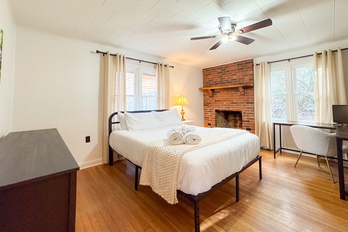 Our second guest bedroom features a queen size bed with comfy, high thread count linens and shredded bamboo pillows! The beds are cooling memory foam with a medium firm feel. Please note the fireplace is not a functional fireplace. 