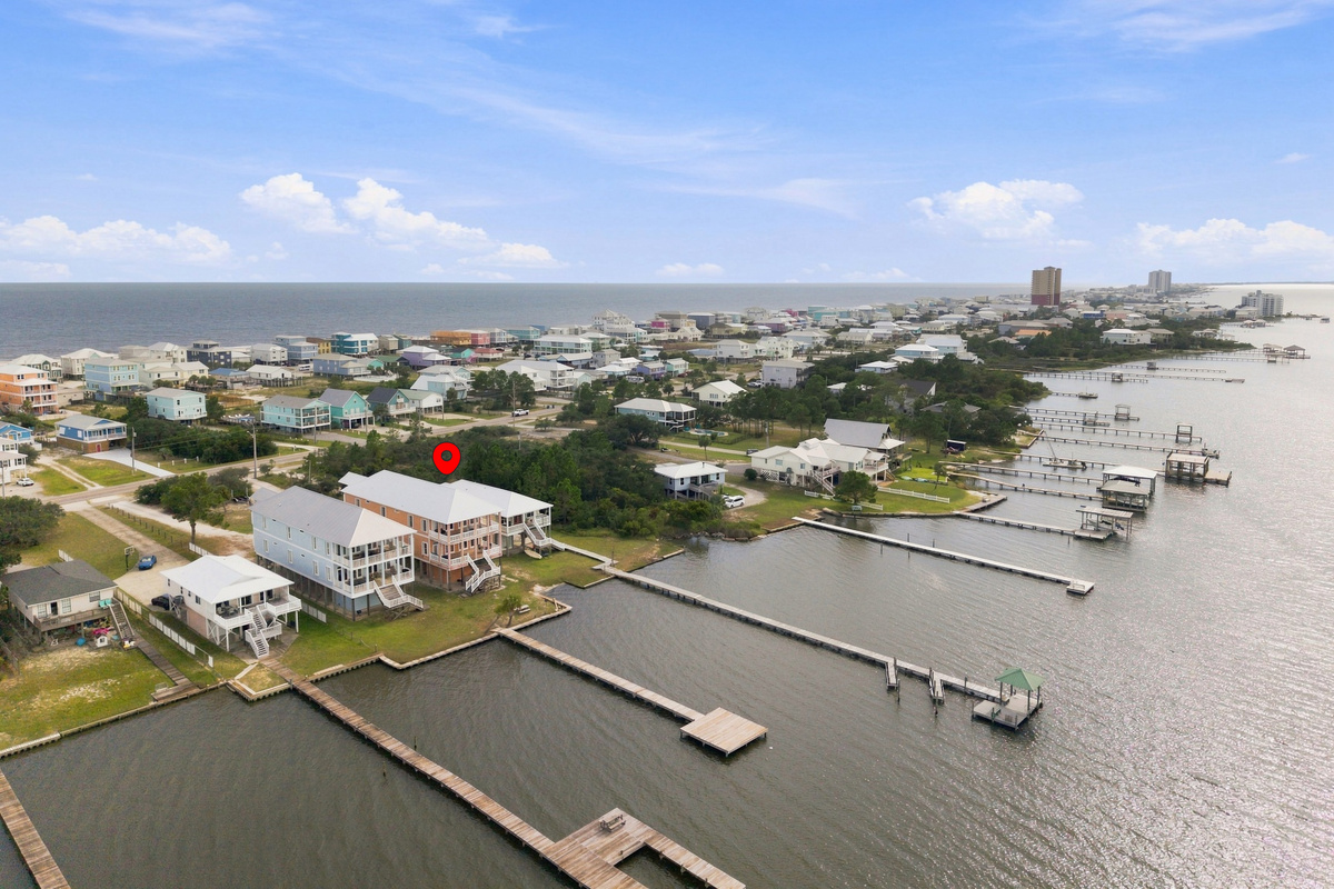 Aerial of the lagoon shoreline dotted with boat docks