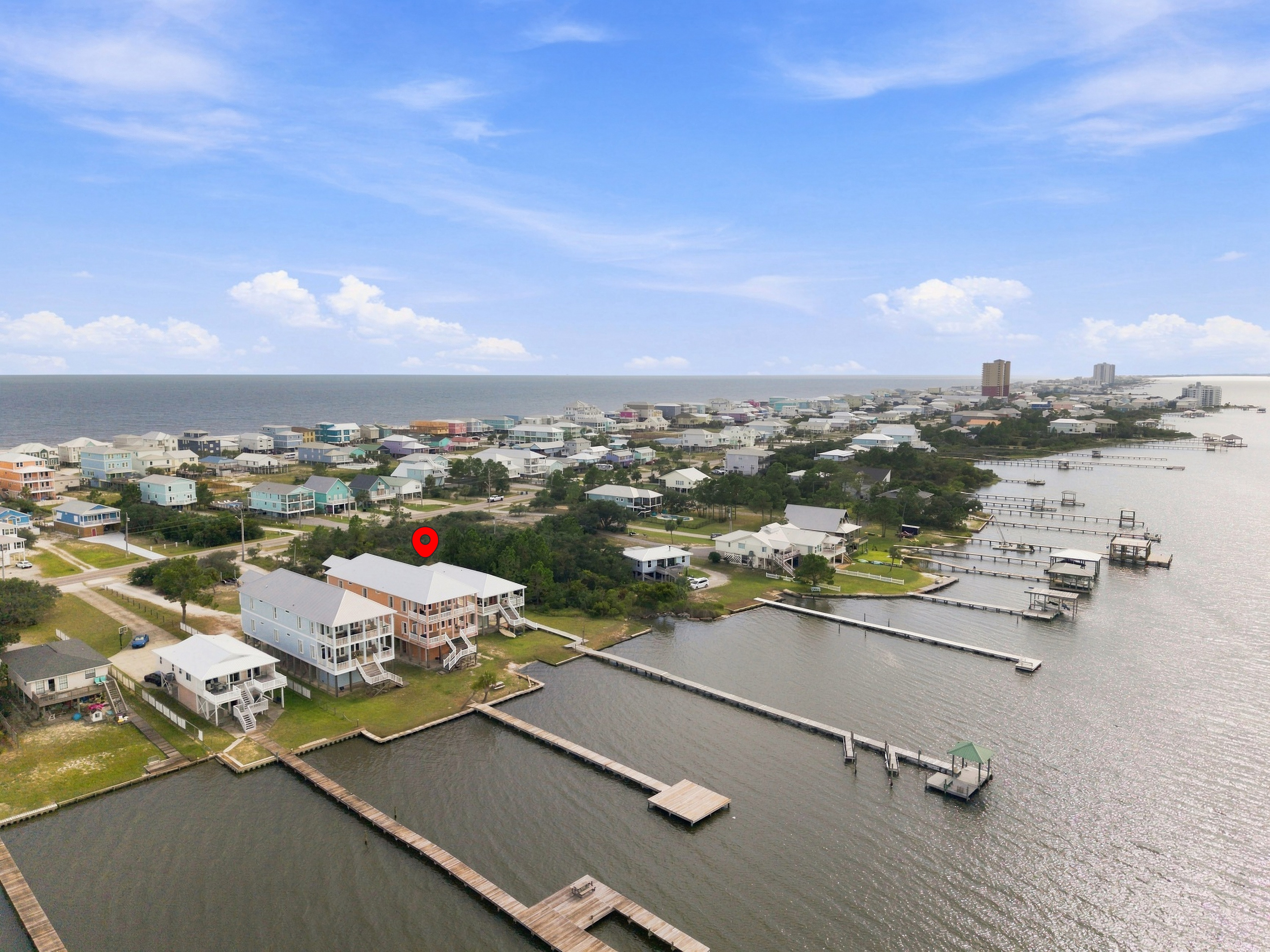 Aerial of the lagoon shoreline dotted with boat docks