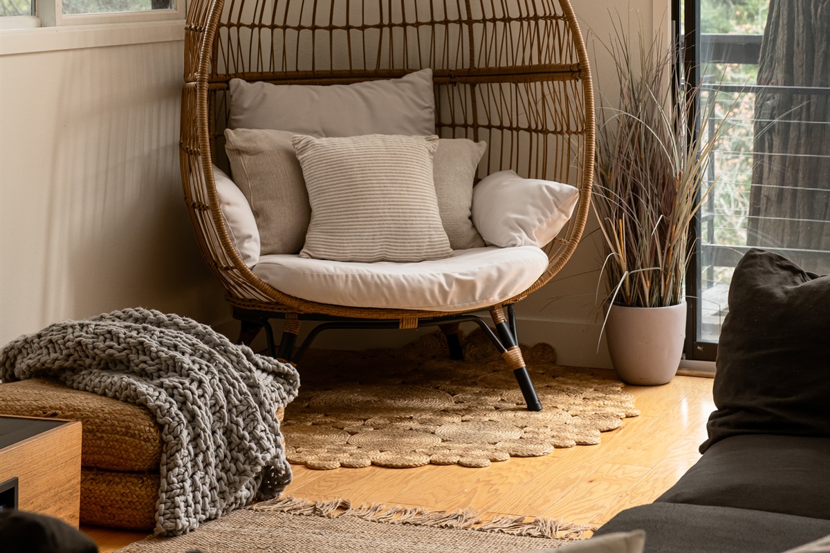 Cozy reading nook with lounge chair and natural light—perfect for relaxing with a book, morning coffee, or unwinding during your mountain getaway