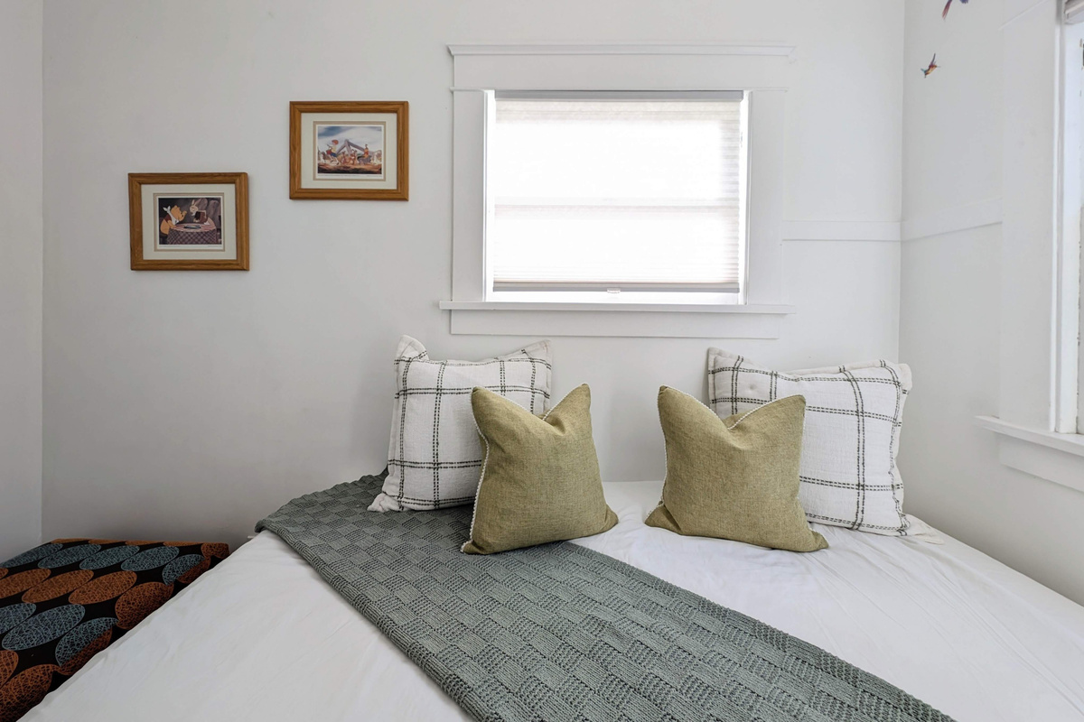 Cozy bonus room with twin bed, soft natural light, and a peaceful atmosphere.