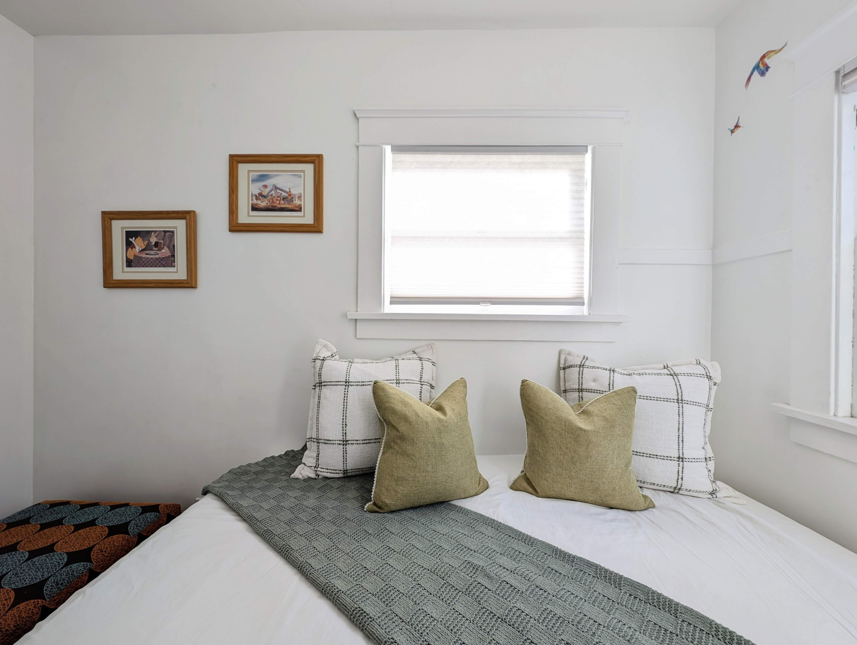 Cozy bonus room with twin bed, soft natural light, and a peaceful atmosphere.