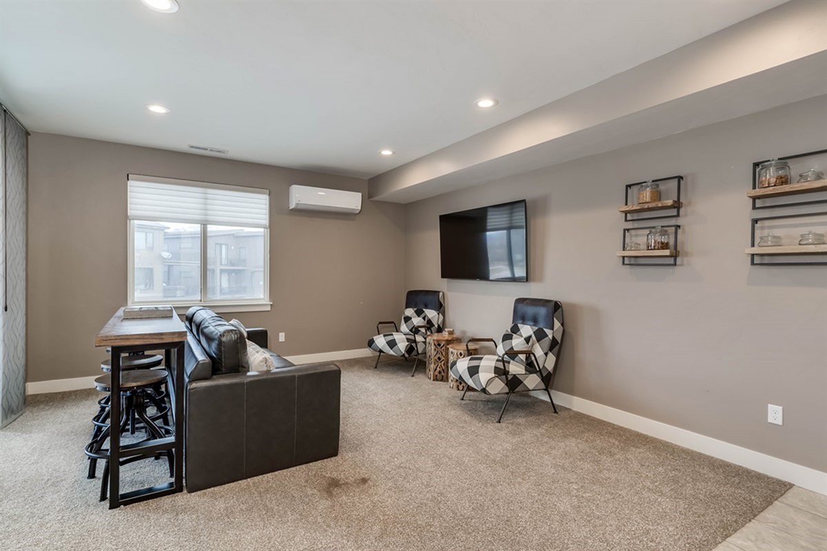 Spacious entertainment area perfect for games, movies, and gathering