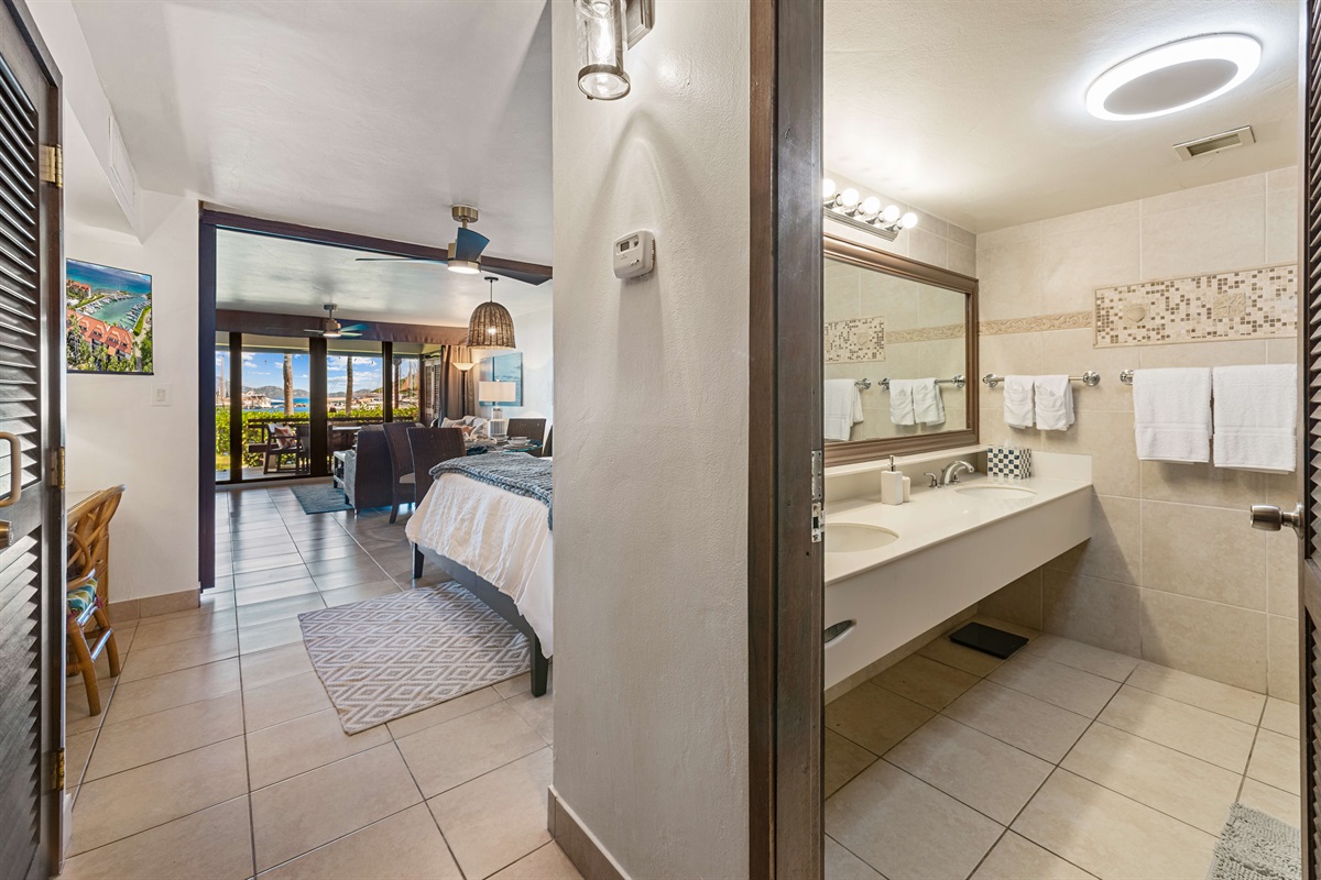 Full bathroom just off of the bedroom, to the right of the front door.