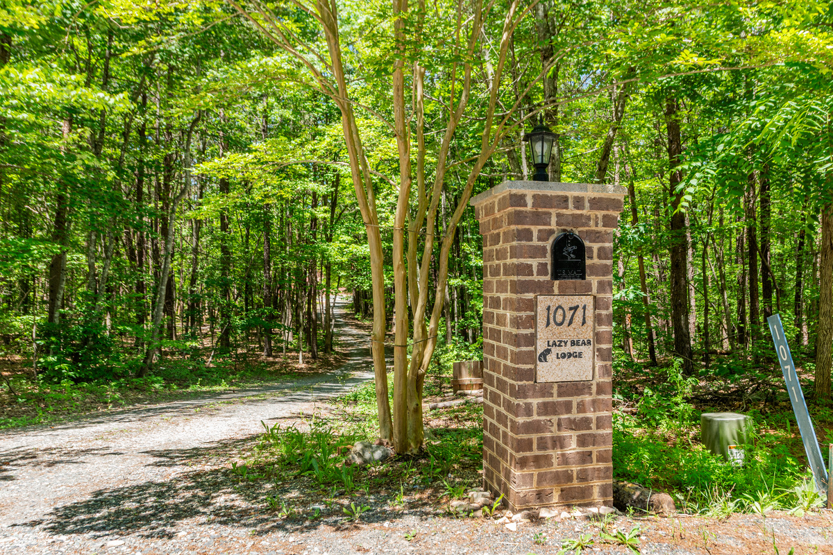 Entrance to Serenity: Discover nature's embrace at Lazy Bear Lodge, your escape awaits!