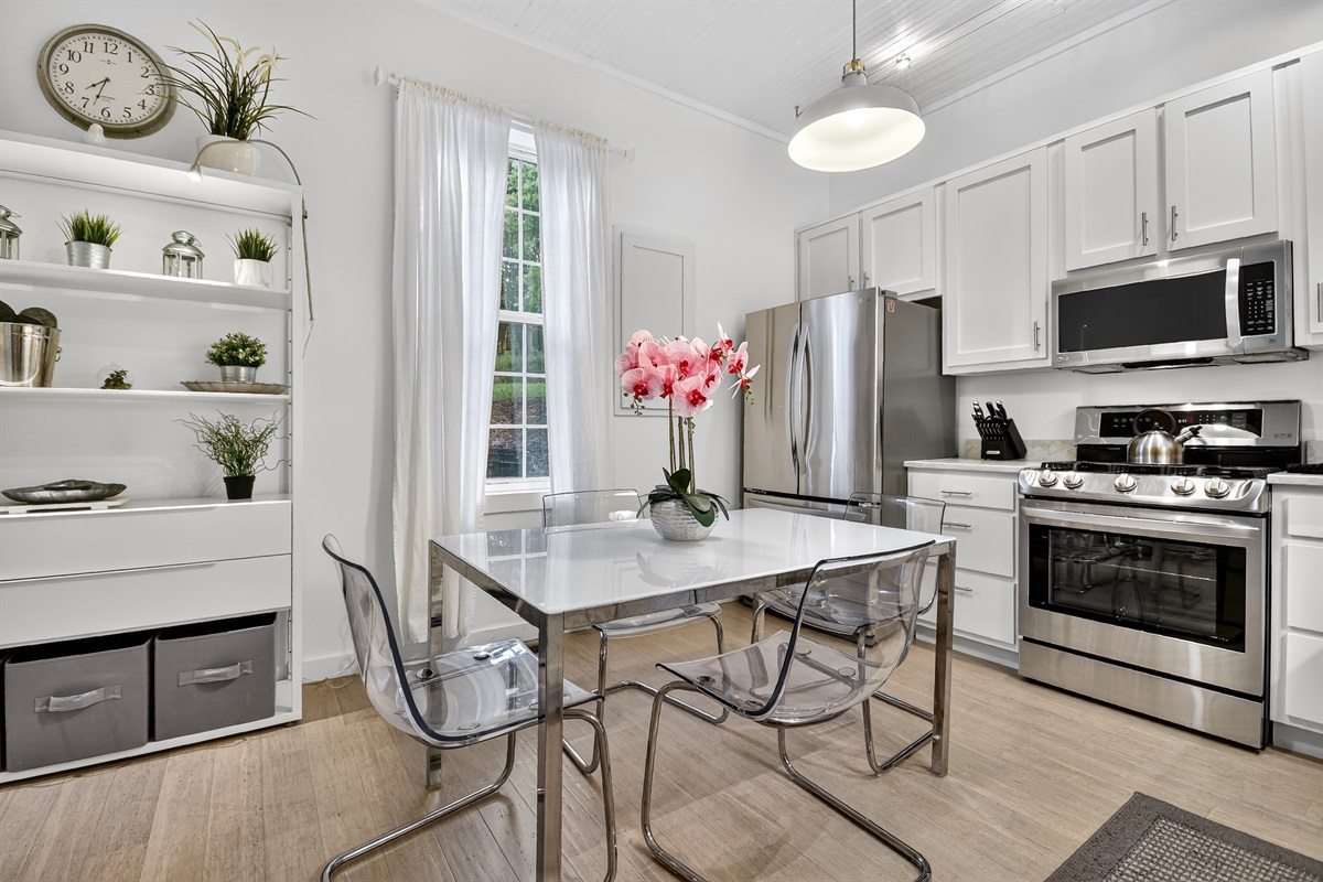 This fully equipped kitchen features stainless appliances, a sleek dining space, and everything you need to enjoy morning coffee or a home-cooked meal during your Blue Ridge escape. 