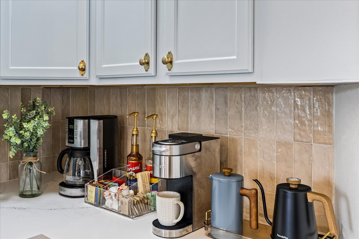 Your choice - Coffee or Tea! Drip coffee pot, Keurig, teas, tea kettle, plus Torani syrup, sugars and creamer.