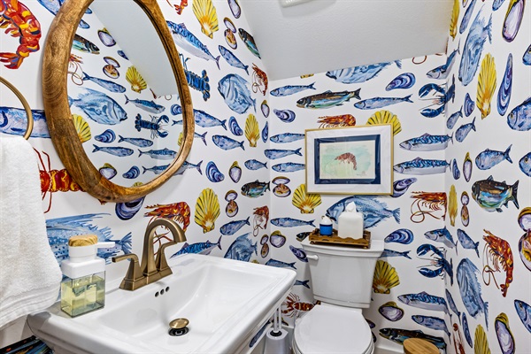 The main floor half bath is convenient for everyone! You'll feel like you are swimming in an aquarium.