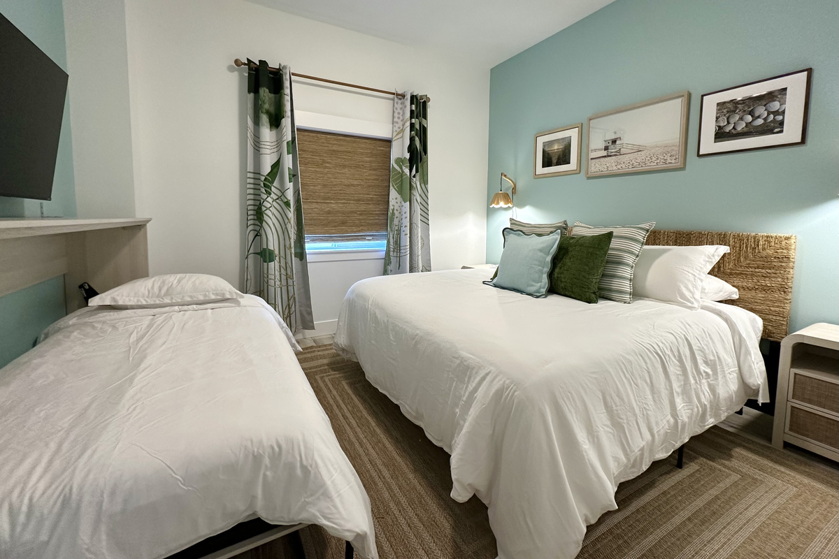 That same king room hides a 10" twin Murphy bed — a real mattress, not a fold-out — so the kids get their own spot without giving up floor space.