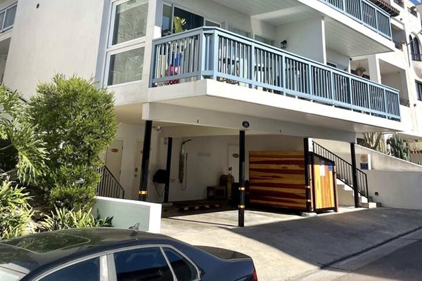 Here is a picture of the exterior of the building. We have added extreme soundproofing so that each suite feels like its own independent villa. Yet, you are right down in the pier bowl steps from the sand.  This condo is the top left balcony