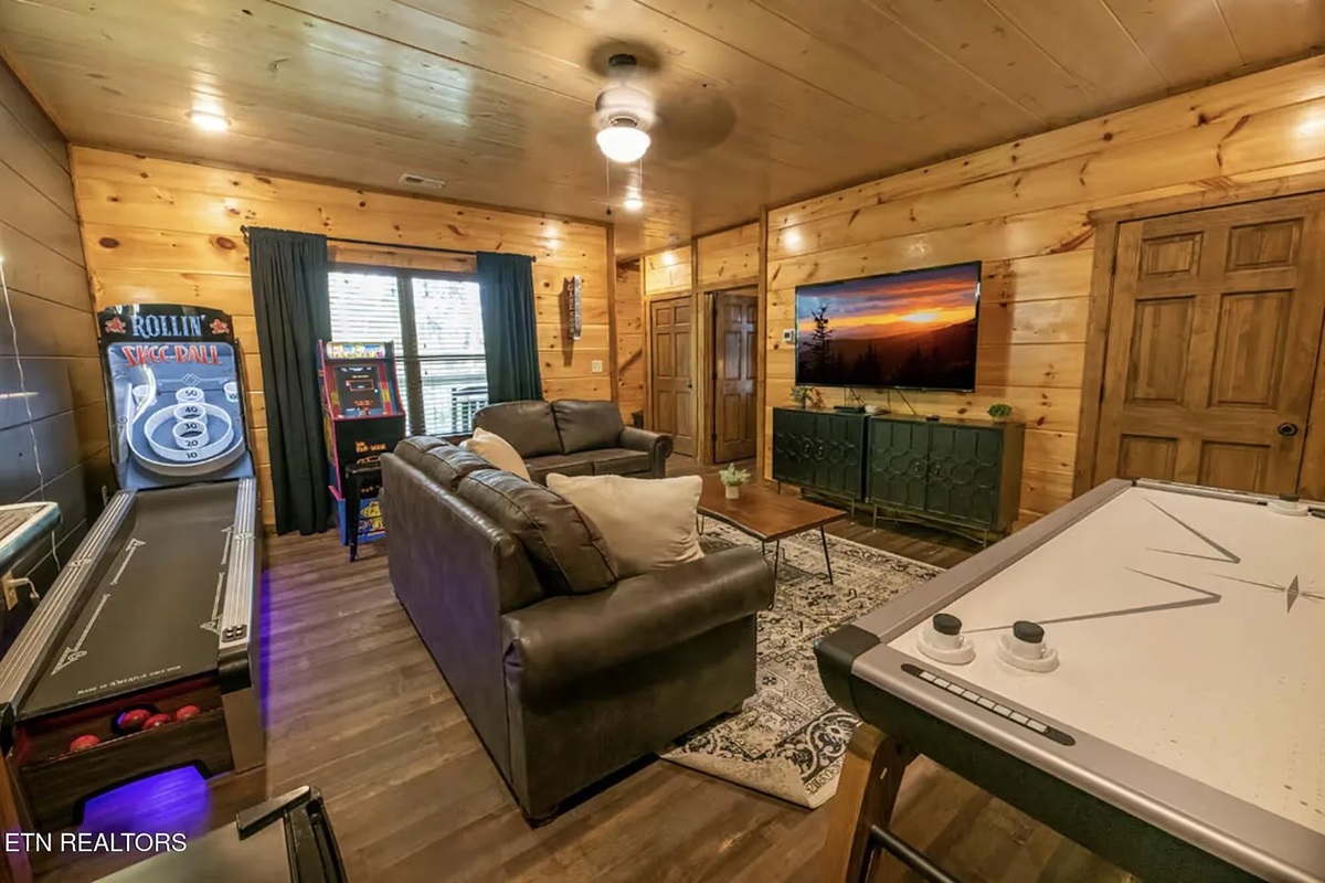 Marigold Cabin's game room is in a league of its own &mdash; featuring Skee-Ball, air hockey, and a home theater setup all in one incredible space. This entertainment powerhouse makes Marigold one of the most sought-after cabin rentals in Pigeon Forge, TN.