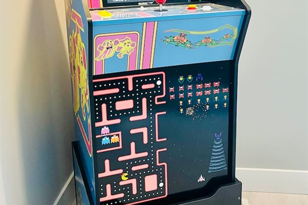 Unlock nostalgia with this life sized arcade system. Enjoy games like Ms. Pac Man, Galaga and more! 