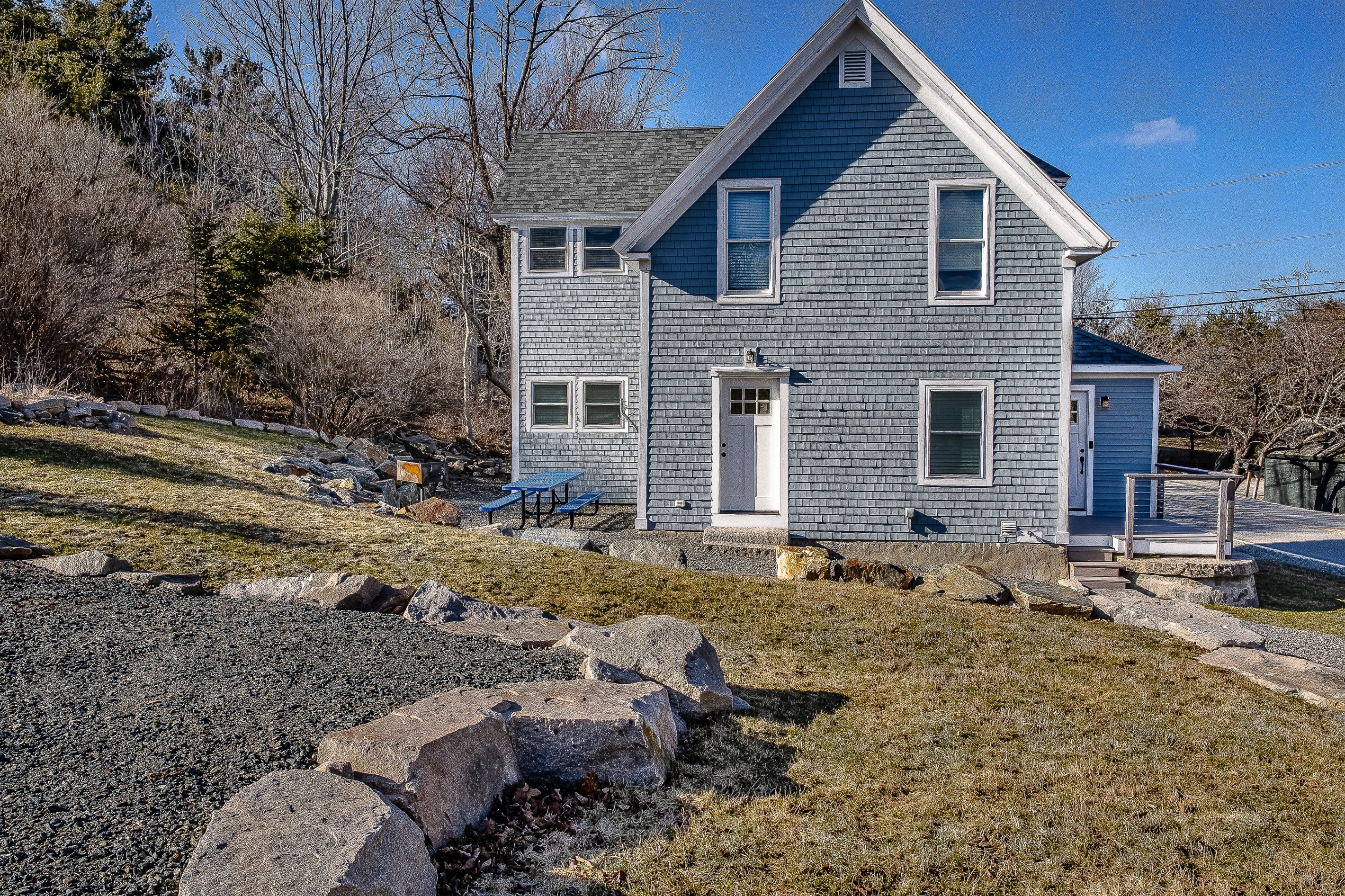 This side view highlights the expansive upper parking area, offering plenty of room for multiple vehicles, a trailer, or even a camper. It’s a rare find on the island, providing the space and convenience needed for a truly flexible Acadia adventure.