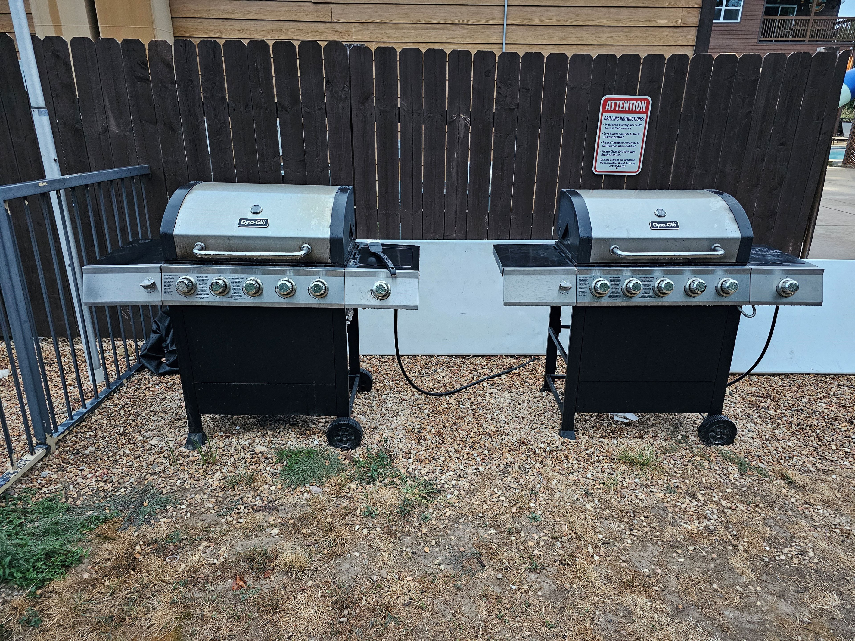 Outdoor community gas grills ready for cookouts & family dinners