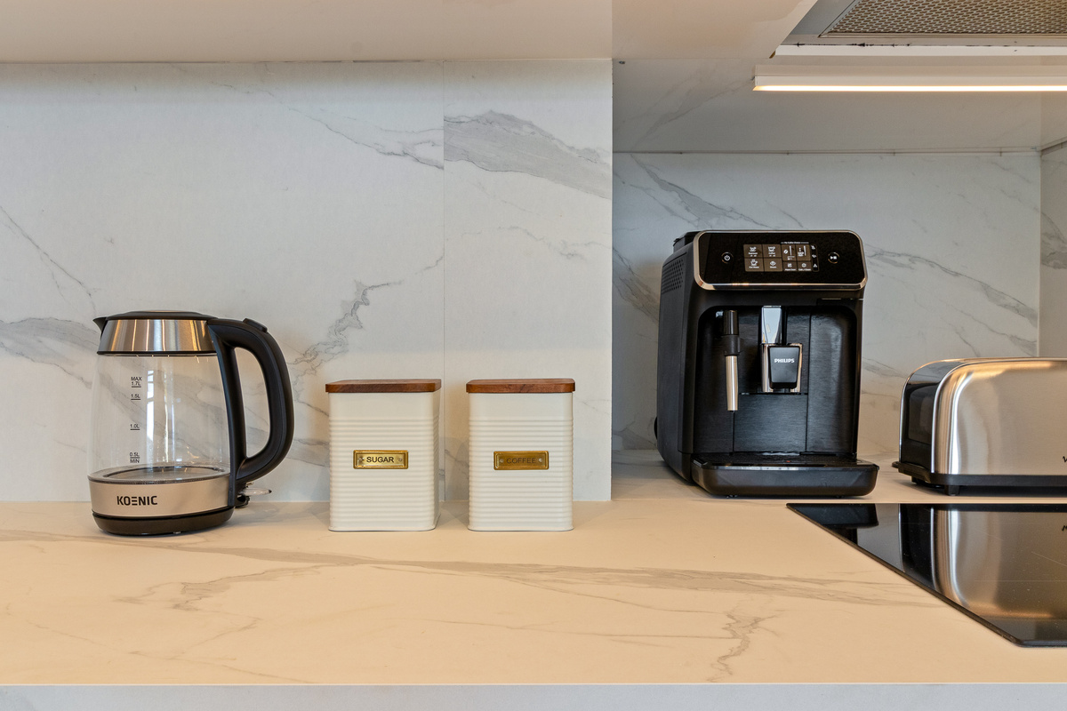 Coffee machine, kettle and breakfast essentials.