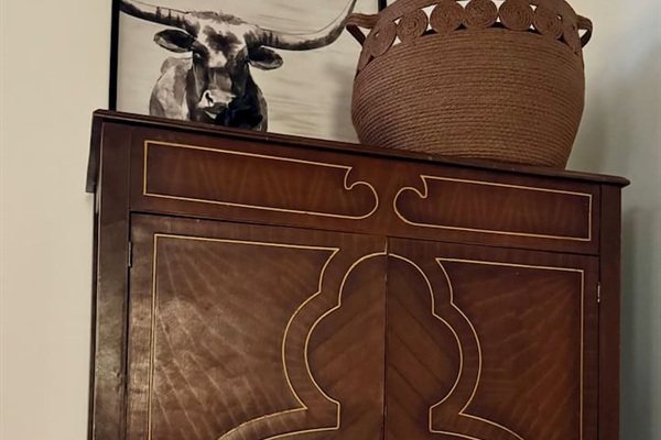Beautiful antique wardrobe serves as your drawers and closet.  