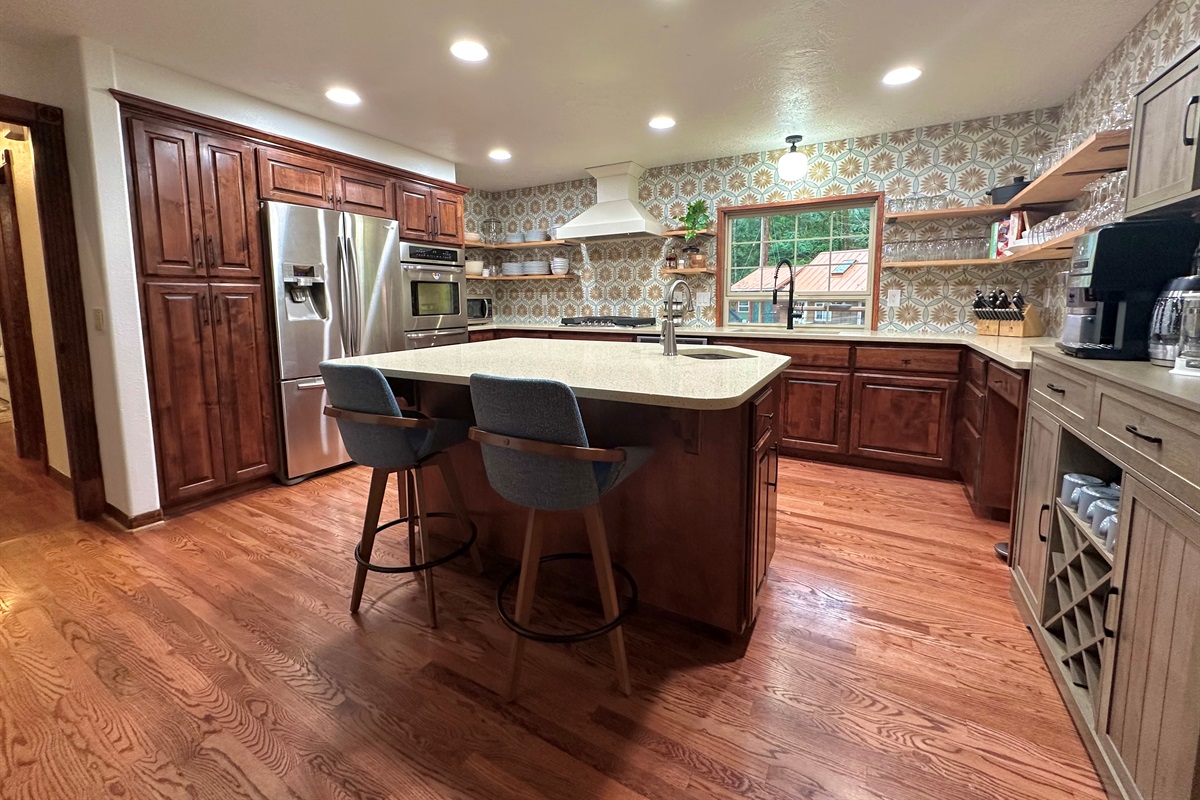 They say the kitchen is the heart of the home, and that is true for River Haven as well. The large updated kitchen offers double ovens, gas cooktop, stocked coffee bar, and of course, plenty of glasses, plates, silverware, cookware and more.  