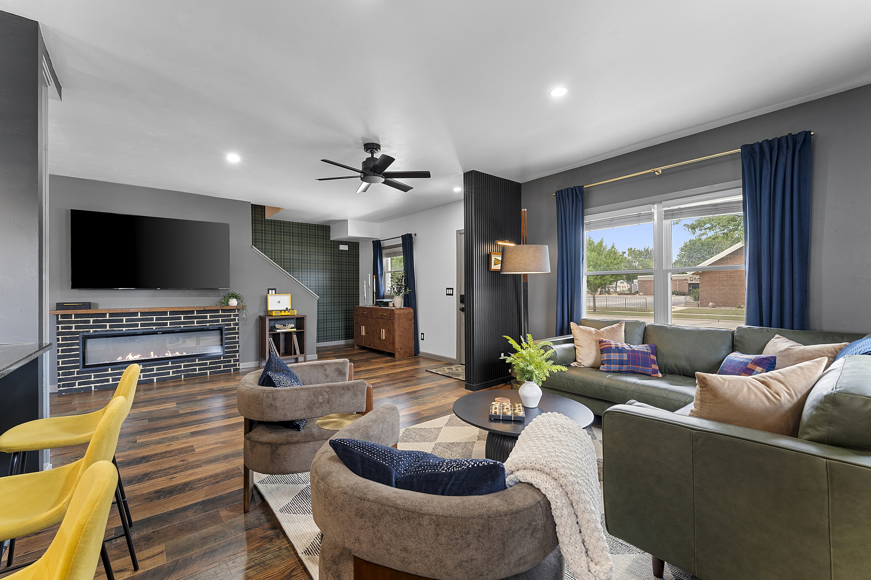 Comfortable living room with plenty of seating and Green Bay-inspired details.