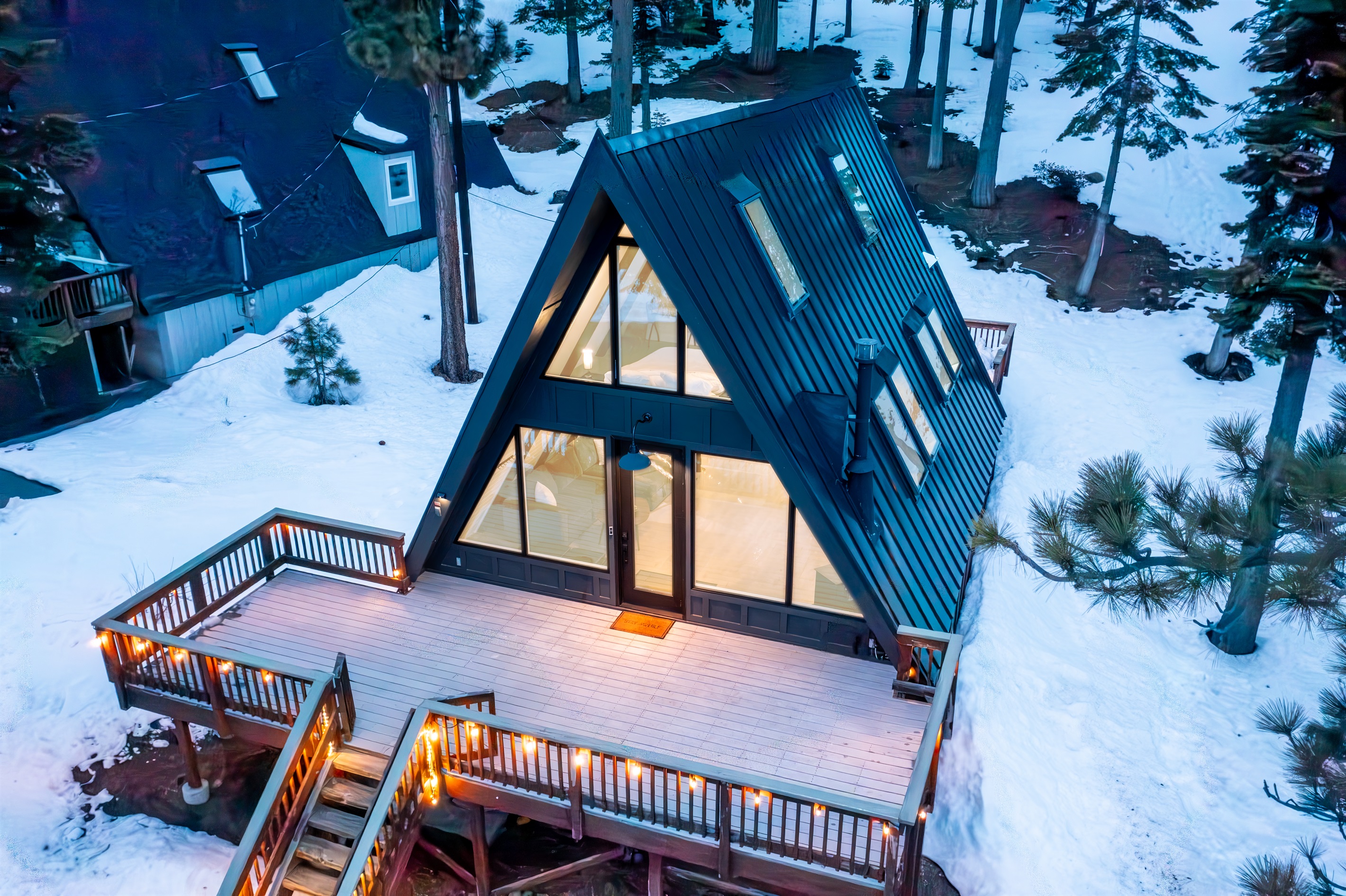 An iconic modern A-Frame with a commanding view of the Lake.