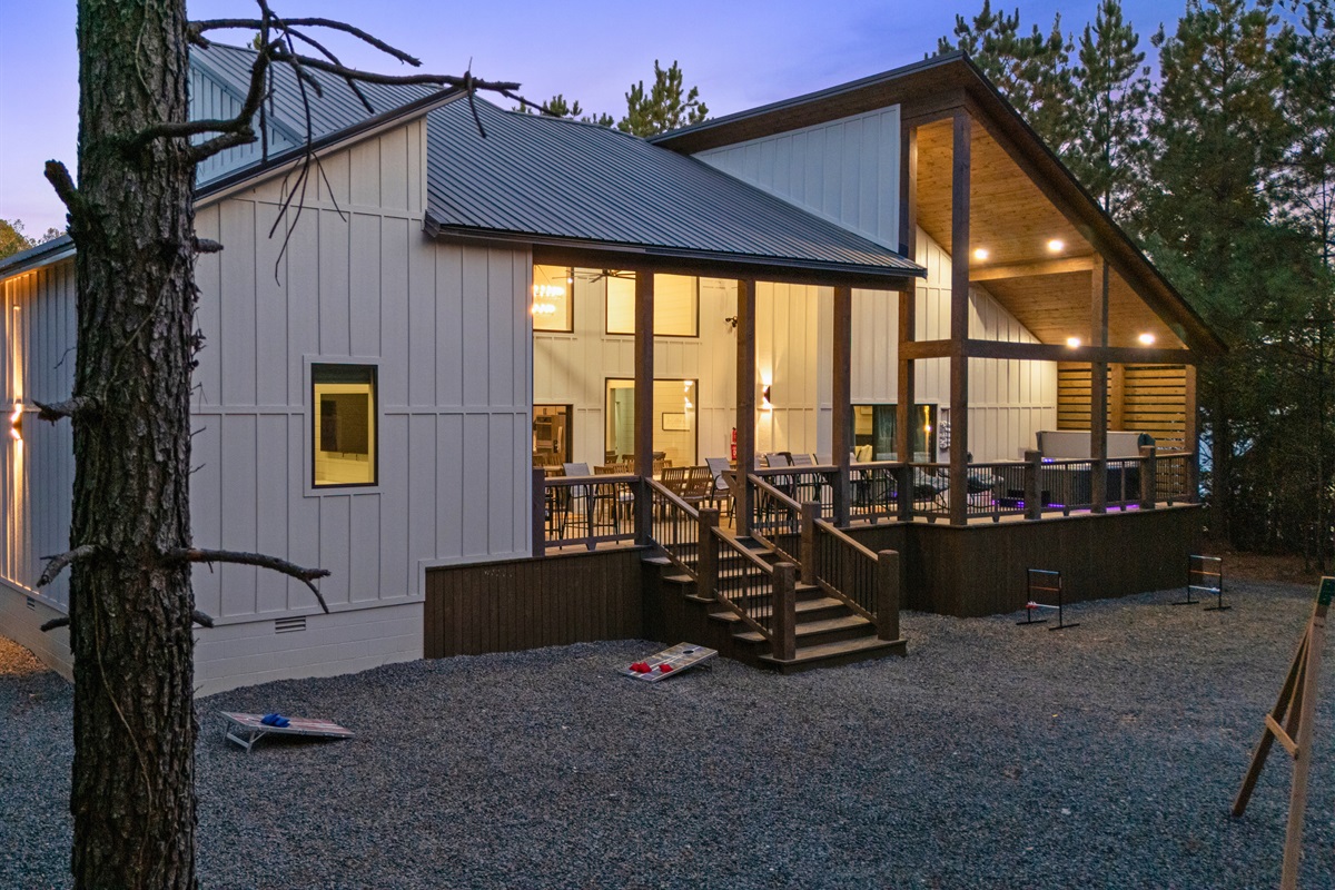 The back deck glows warmly at dusk, creating a cozy and welcoming spot to gather as the day winds down.