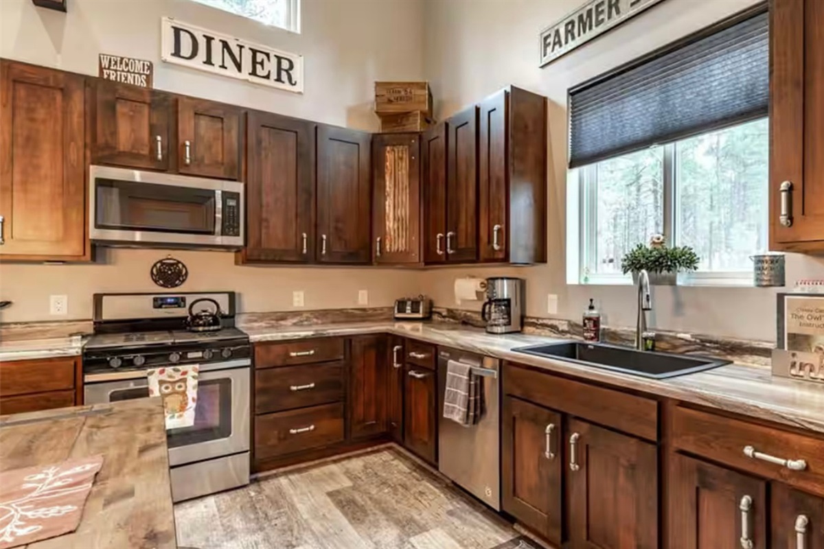 Fully equipped kitchen with modern appliances and plenty of workspace.