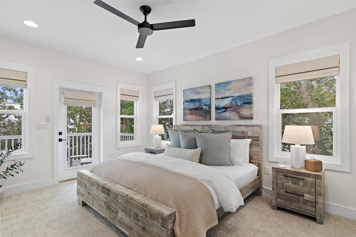 The 2nd Floor Primary Suite mirrors the first floor primary suite.  This oversized room offers a luxurious king bed, large closet, dresser, smart TV, ensuite bath, and private access to the 2nd floor rear porch.