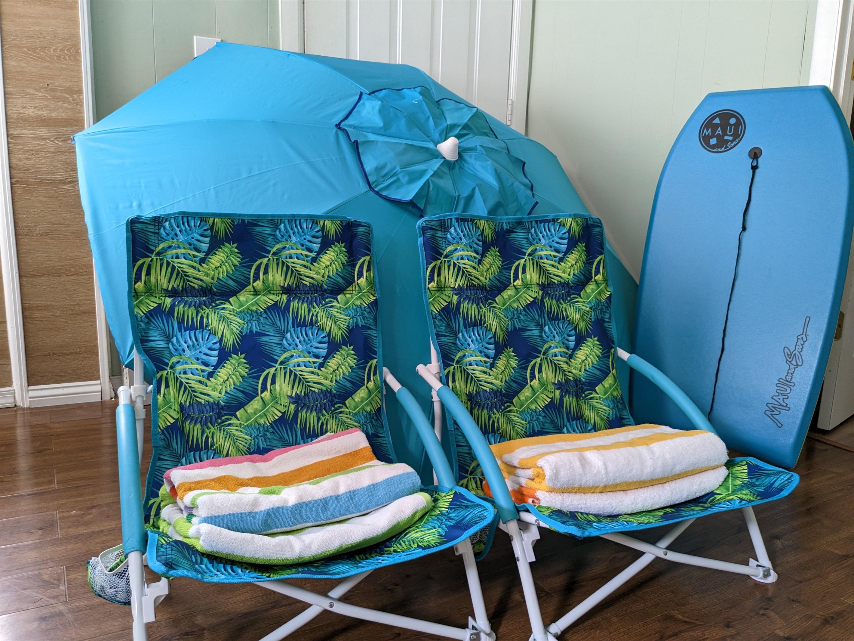 All the beach gear you need including 4 Beach chairs, towels, boogie board and umbrella