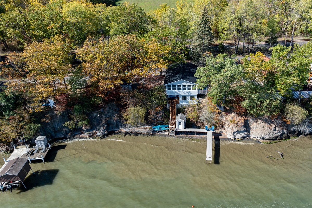 Signature blue lake house perched right above the water—picture-perfect Finger Lakes gem