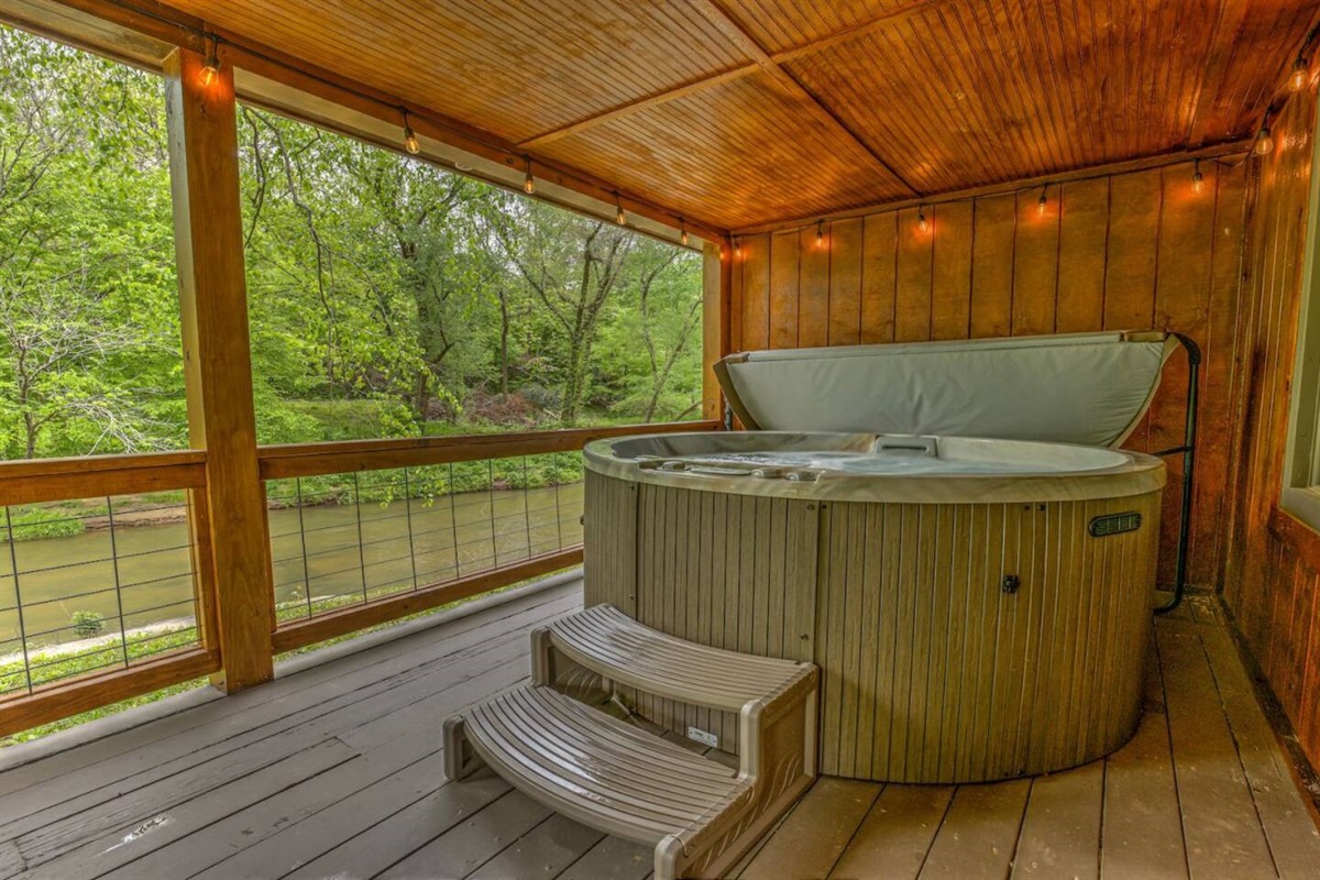 Relax in the hot tub overlooking Hemptown Creek from the back deck.