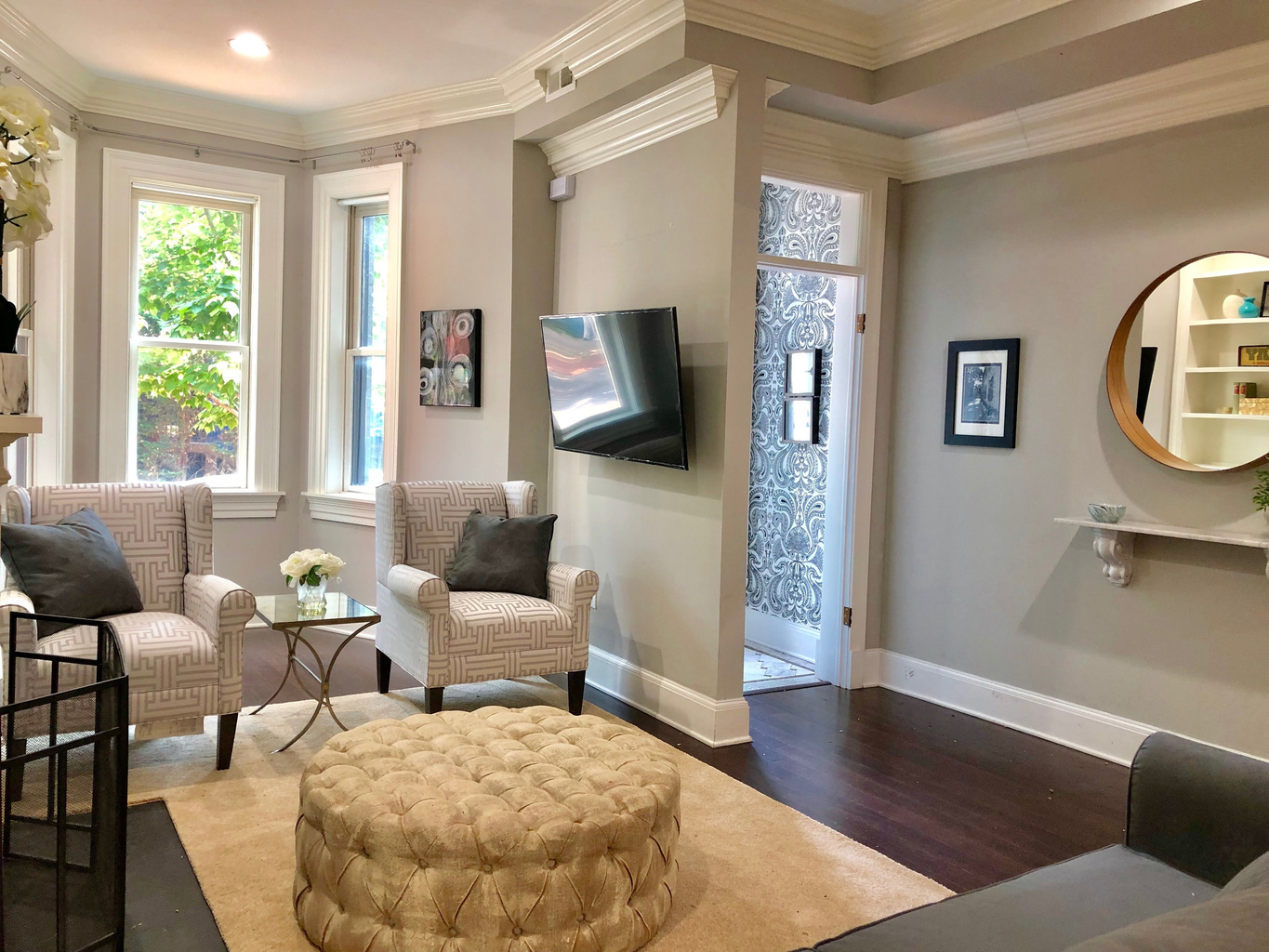 Enter into a warm, welcoming living space with thoughtful design, natural light, and timeless comfort waiting just beyond the front door.