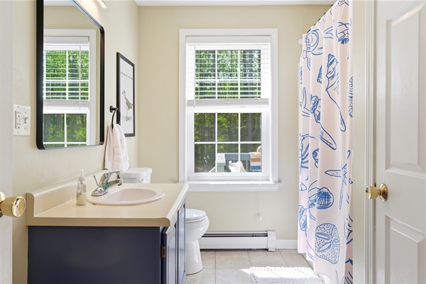 A clean and modern bathroom designed for comfort and convenience, offering a fresh and relaxing space to refresh and unwind.