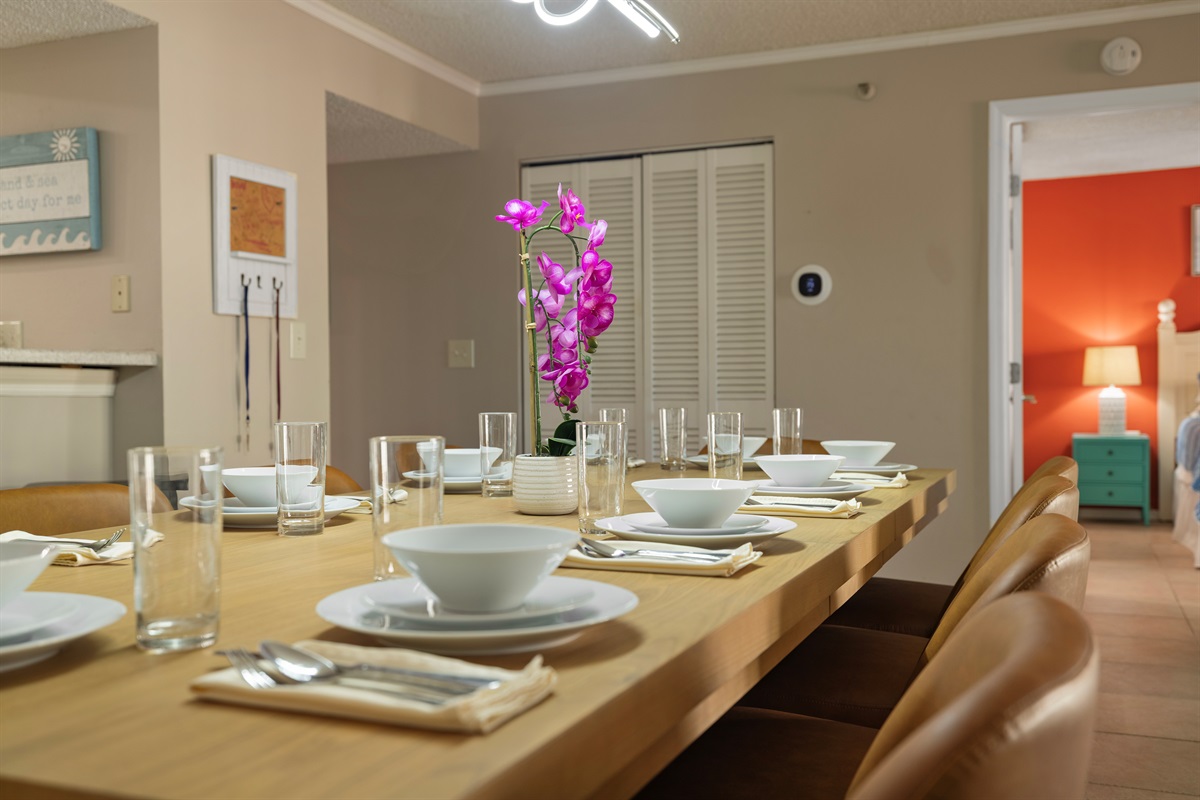 Dining room table seats 10 plus 3 additional bar stools.