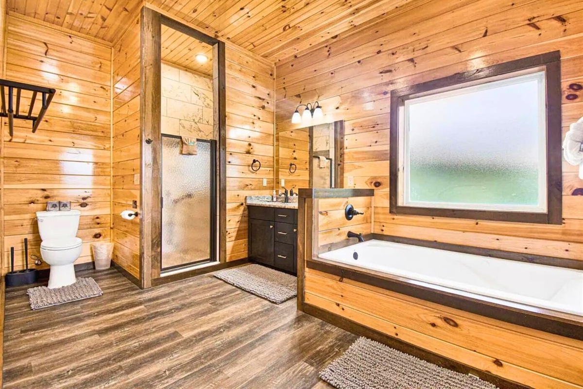 Ensuite Bathroom with Deep Soaking tub, Bright Vanity and Walk-In Shower