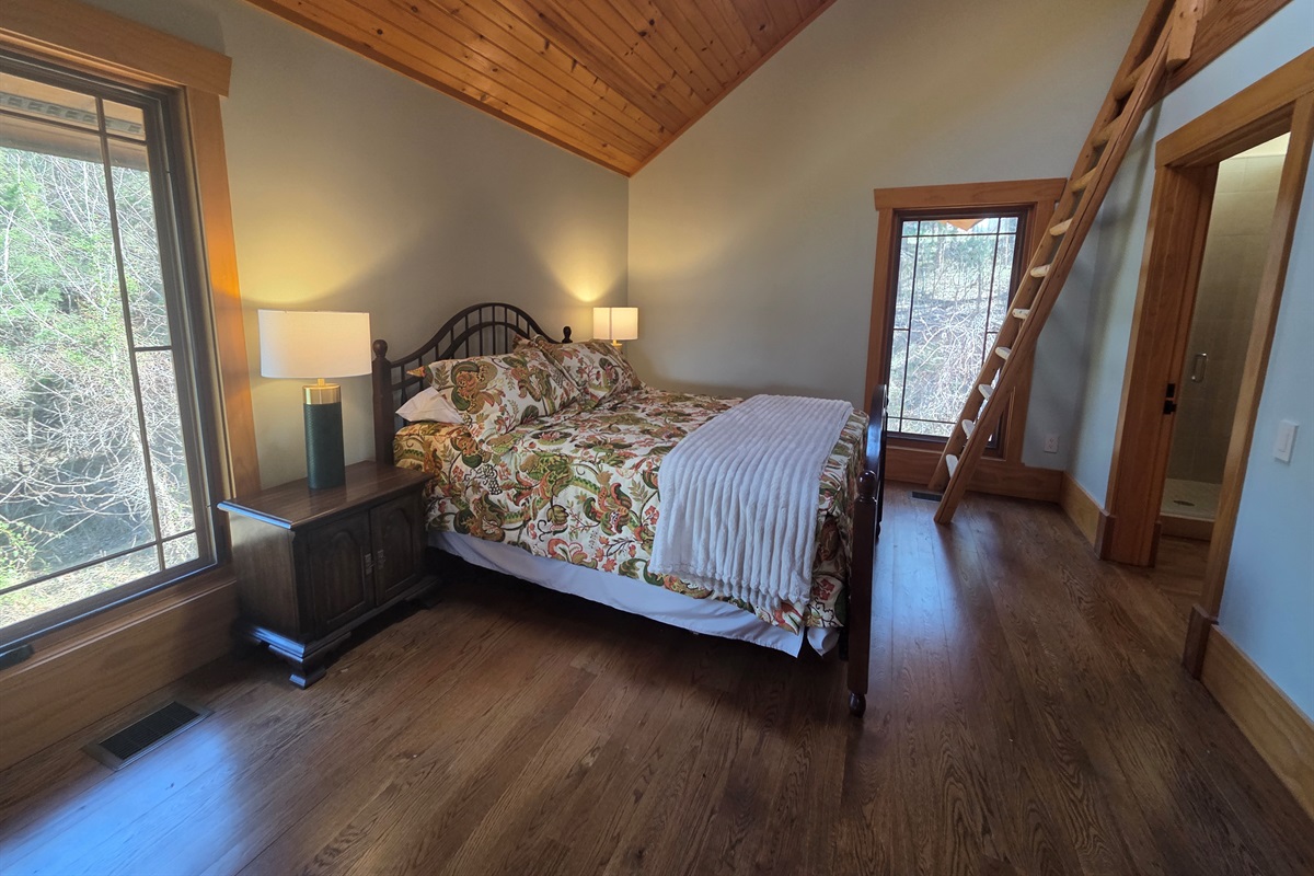 Carriage apartment bedroom with a queen bed
