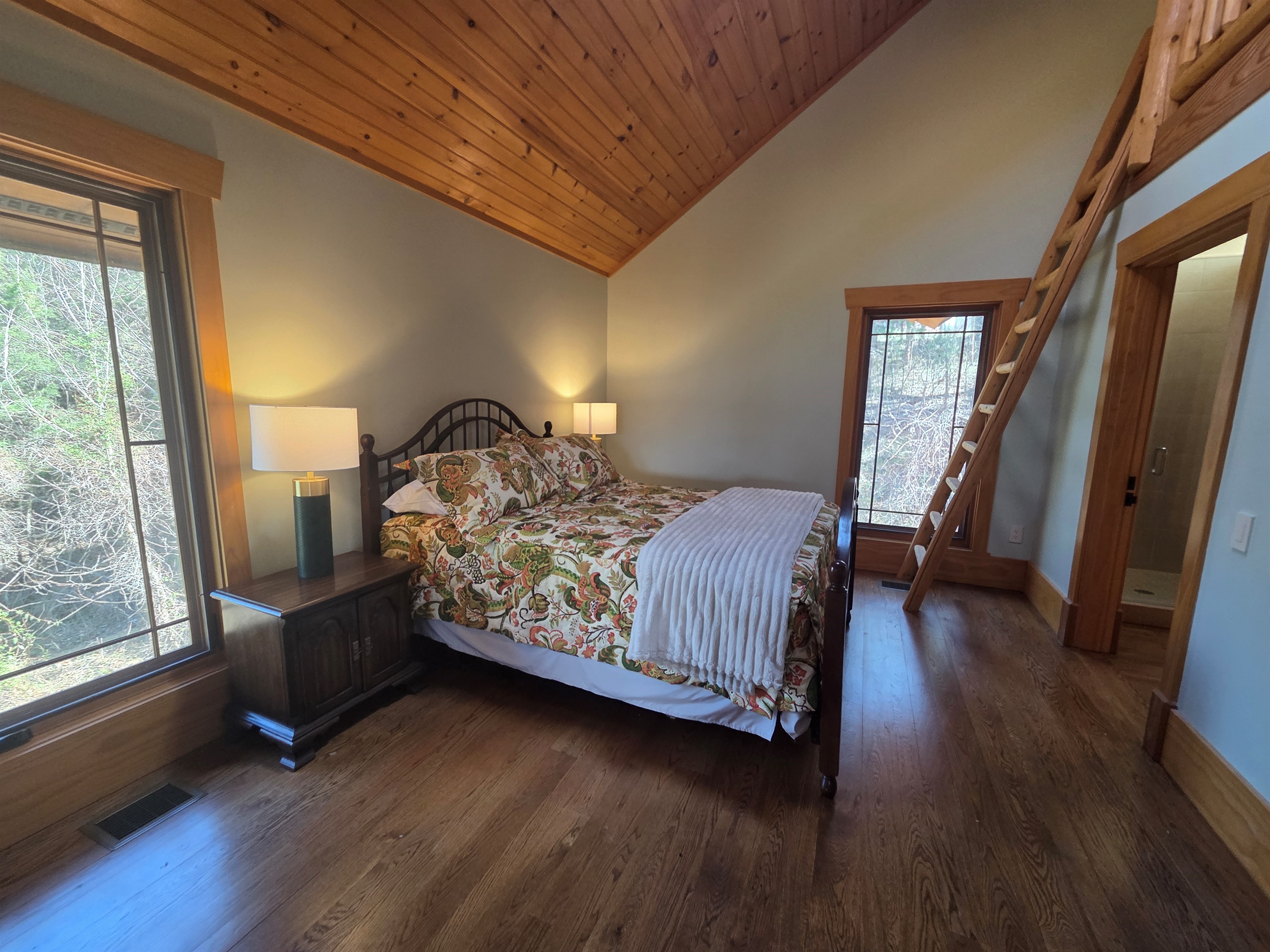 Carriage apartment bedroom with a queen bed