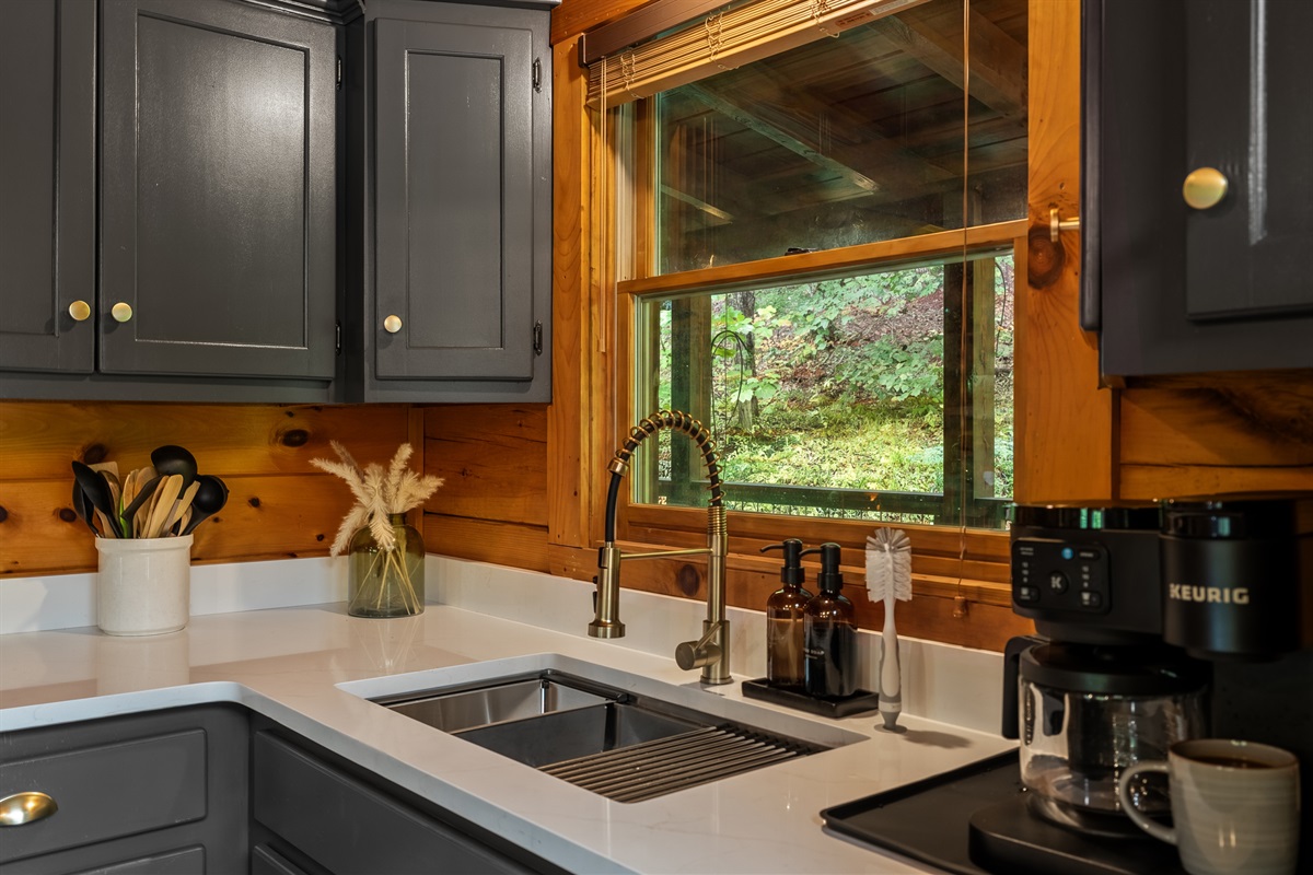 A fully equipped kitchen featuring modern appliances and all the essentials needed to prepare anything from quick bites to full family meals.