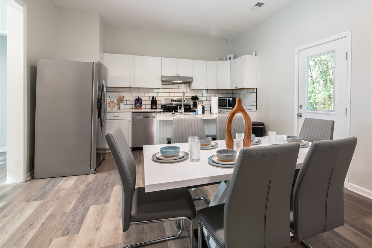 A spacious dining area designed for gathering, sharing meals, and enjoying time together.