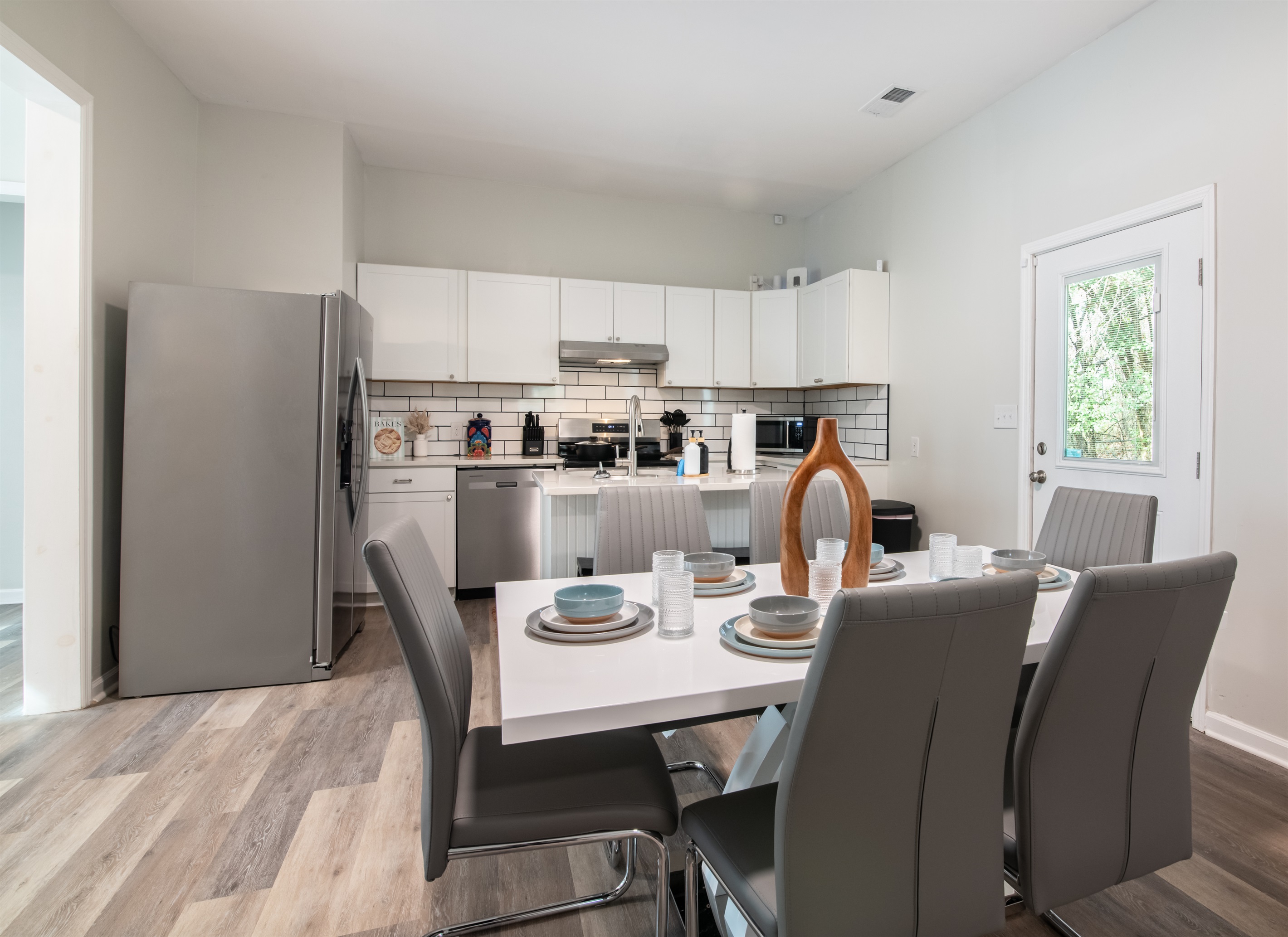 A spacious dining area designed for gathering, sharing meals, and enjoying time together.