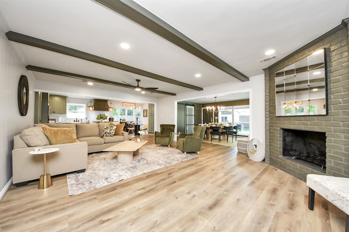 Large living space complete with couch, and 4 chairs.