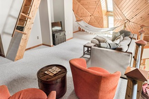 Living room with hammocks, couch and arm chair