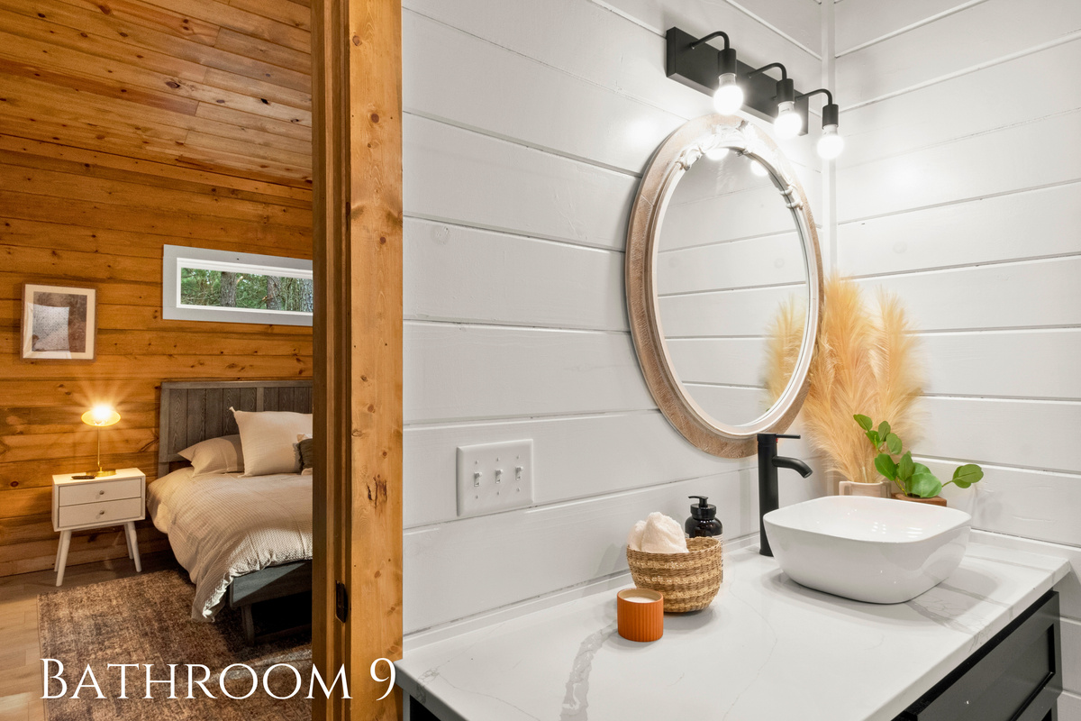 Bright and airy, this bathroom combines the freshness of white shiplap with the warmth of wood accents.