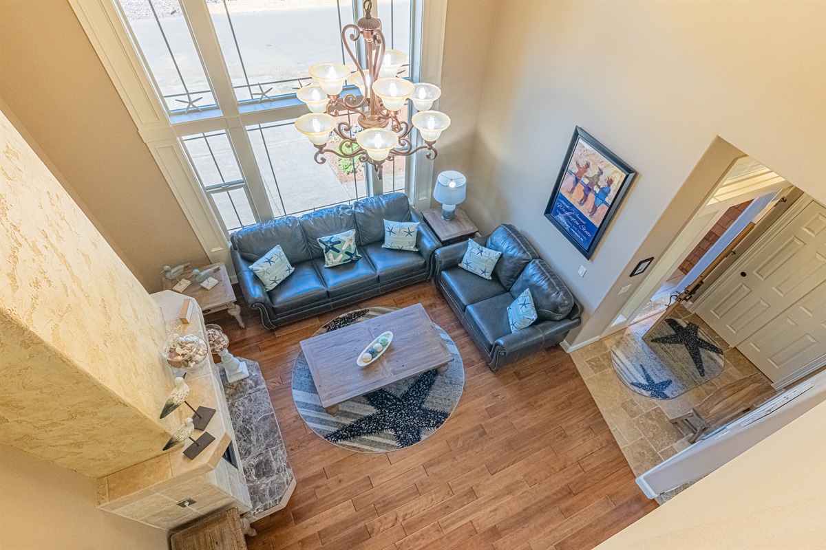 20 ft ceilings and a wall full of windows allows light to pour throughout the house.